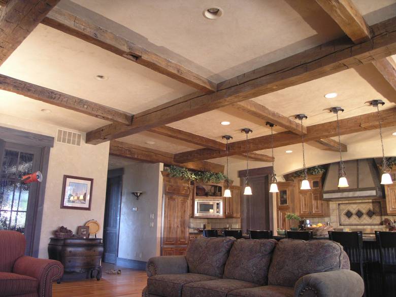 Hand-Hewn Timbers / These hand-hewn timbers were stained by the contractor before installation